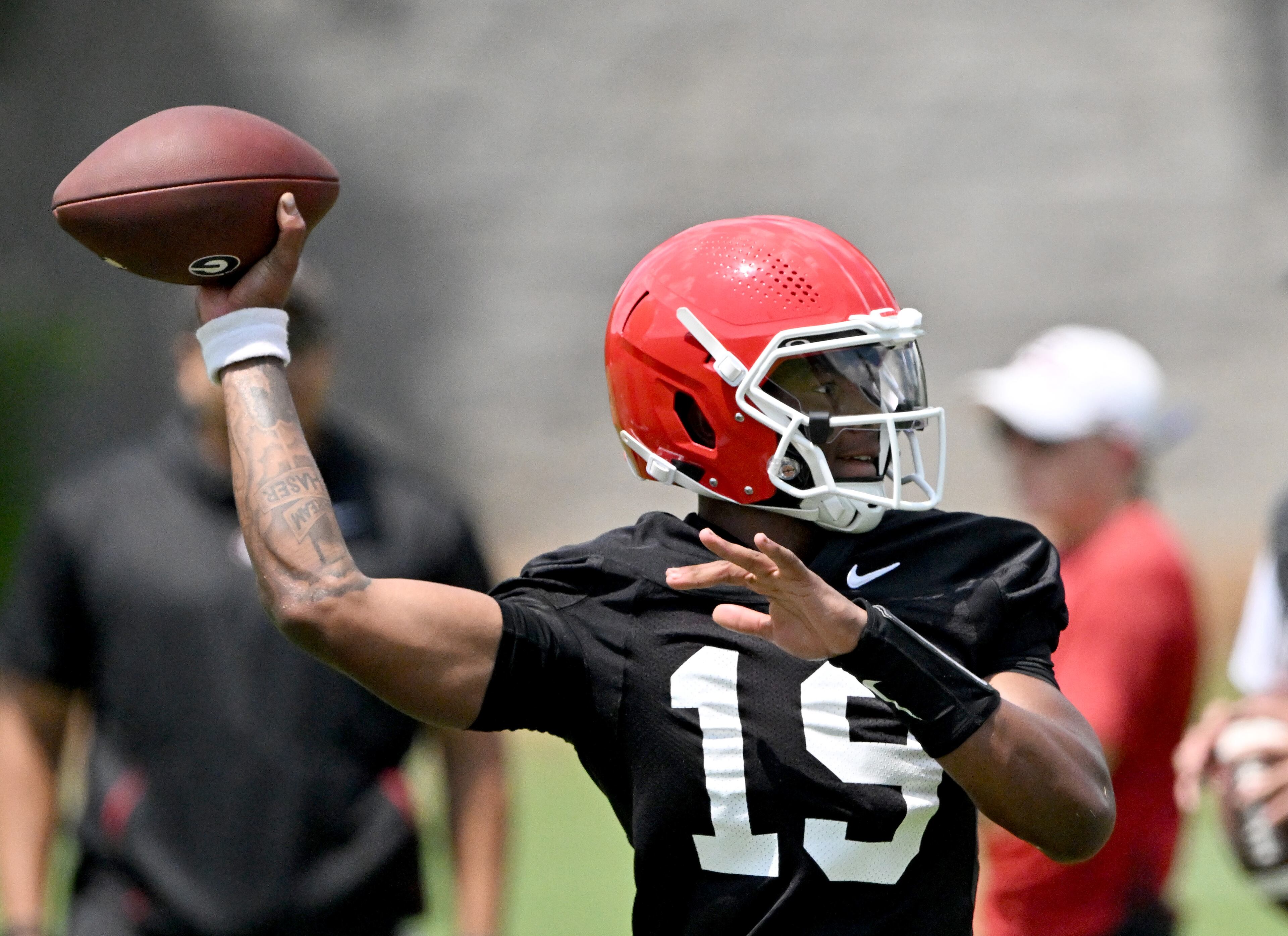 Georgia quarterback Hezekiah Millender (19) runs a drill during a football practice at the University of Georgia practice facility, Thursday, July 31, 2025, in Athens. (Hyosub Shin / AJC)