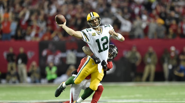 Packers quarterback Aaron Rodgers (12) is sacked during the NFC Championship game against the Packers in Atlanta, Georgia, on Sunday, January 22, 2017. (DAVID BARNES / DAVID.BARNES@AJC.COM)