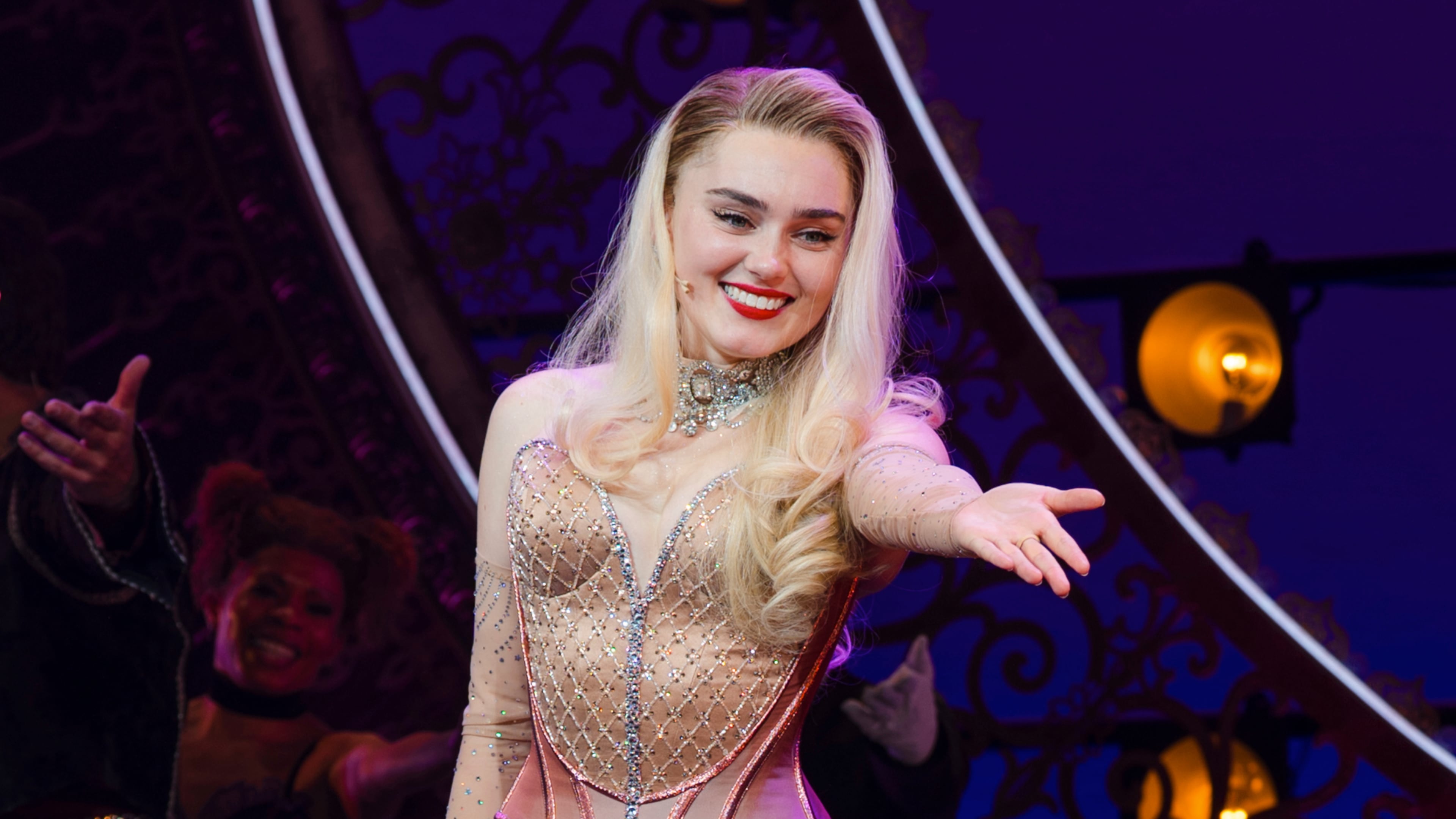 This image released by Boneau/Bryan-Brown shows Meg Donnelly during the curtain call after making her Broadway debut in "Moulin Rouge! The Musical" in New York on Tuesday, Nov. 11, 2025. (Avery Brunkus/Boneau/Bryan-Brown via AP)