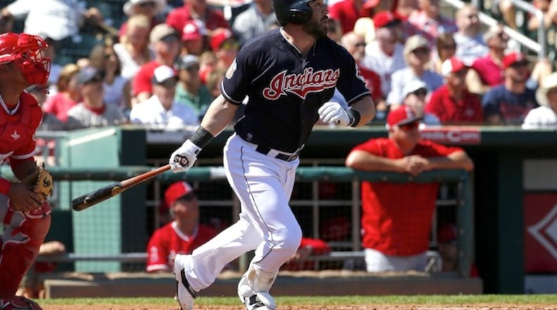 Cleveland Indians' Jason Kipnis watches his solo home run take flight against the Los Angeles Angels during the first inning of a spring training baseball game, Wednesday, March 16, 2016, in Goodyear, Ariz. (AP Photo/Matt York)