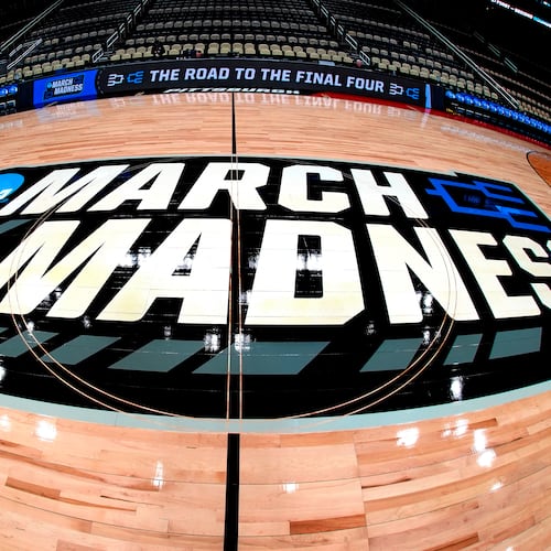 FILE - March Madness logo sis displayed at center court during the opening rounds of the NCAA college basketball tournament in Pittsburgh, Wednesday, March 20, 2024. (AP Photo/Gene J. Puskar, File)