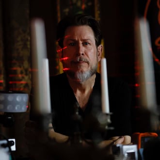 Paranormal investigator Philip Wyatt posed for a photograph in his home on Tuesday, Oct. 13, 2025. He has been investigating paranormal events for 15 years, a pursuit that began after personal experiences sparked his interest. (Miguel Martinez/AJC)