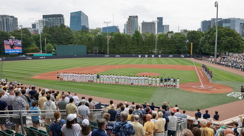 Georgia Tech and Illinois Chicago players and fans stand for the national anthem before the start of their Atlanta Regional game Friday, May 29, 2026, at Russ Chandler Stadium in Atlanta. (Erik S. Lesser for the AJC)