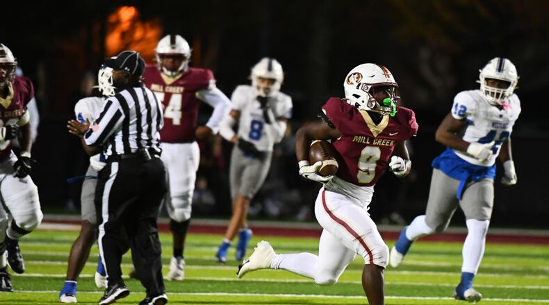 Cameron Robinson runs the ball for Mill Creek during the Westlake vs. Mill Creek High School Football game on Friday, Nov. 25, 2022, at Mill Creek High School in Hoschton, Georgia. (Jamie Spaar for the Atlanta Journal Constitution)
