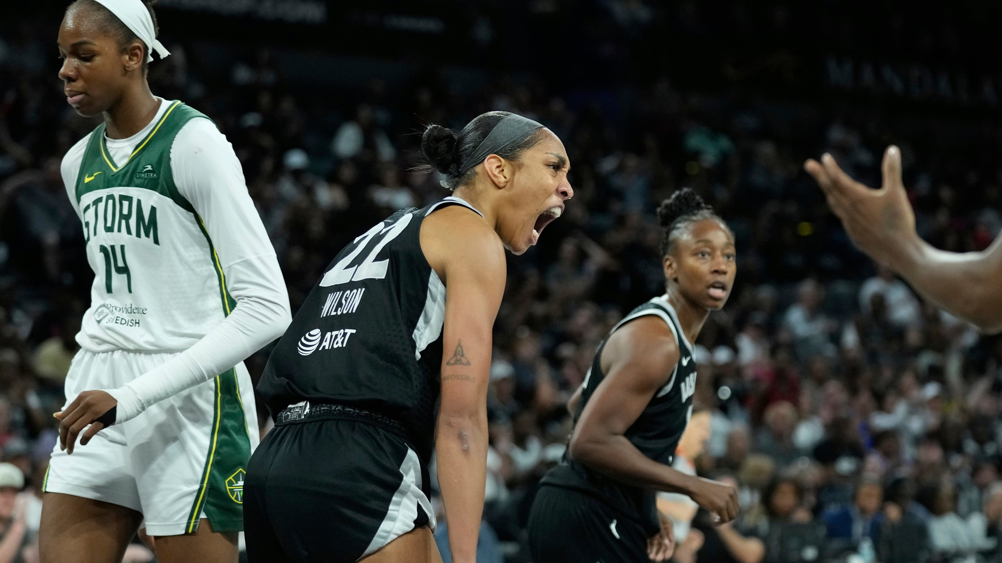 Las Vegas Aces center A'ja Wilson (22) celebrates after a play against the Seattle Storm during the second half of Game 3 in the first round of the WNBA basketball playoffs Thursday, Sept. 18, 2025, in Las Vegas. (AP Photo/John Locher)