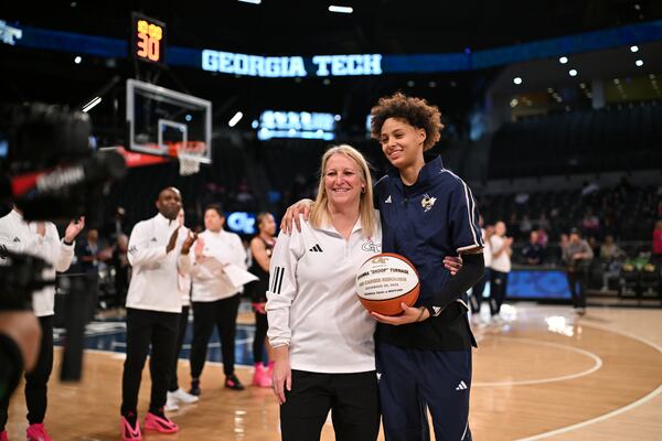 Georgia Tech coach Karen Blair with Briana "Snoop" Turnage, the team's rebound leader, on Senior Day, March 1, 2026. (Danny Karnik/Georgia Tech)