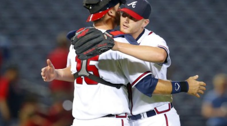 Shelby Miller gets a hug from catcher A.J. Pierzynski after Miller's three-hit shutout against the Phillies last week. (AP photo)