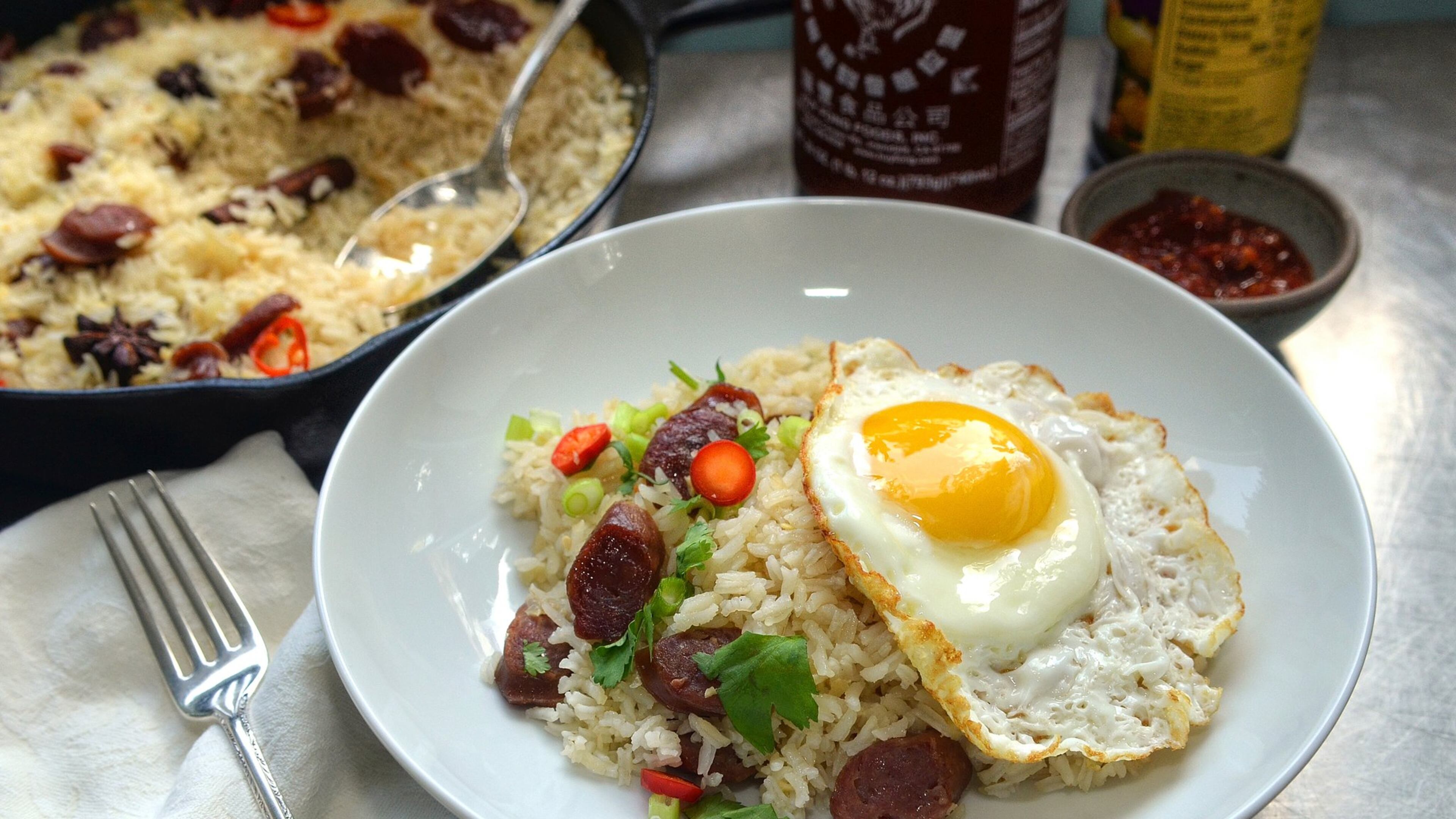 Asian cuisine, like this rice and Chinese sausage dish created by Lazy Betty co-owner/culinary director Ron Hsu, is evolving in the metro Atlanta area. (Chris Hunt for The Atlanta Journal-Constitution/Food styling by Wendell Brock)