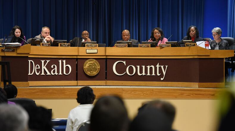 The DeKalb County Board of Commissioners couldn’t agree Tuesday on plans for a sales tax to fund road repaving, a government center and other infrastructure. From left: Commissioners Nancy Jester, Jeff Rader, Larry Johnson, Stan Watson, Sharon Barnes Sutton, Mereda Davis Johnson and Kathie Gannon. Watson resigned from the board in March. MARK NIESSE / MARK.NIESSE@AJC.COM