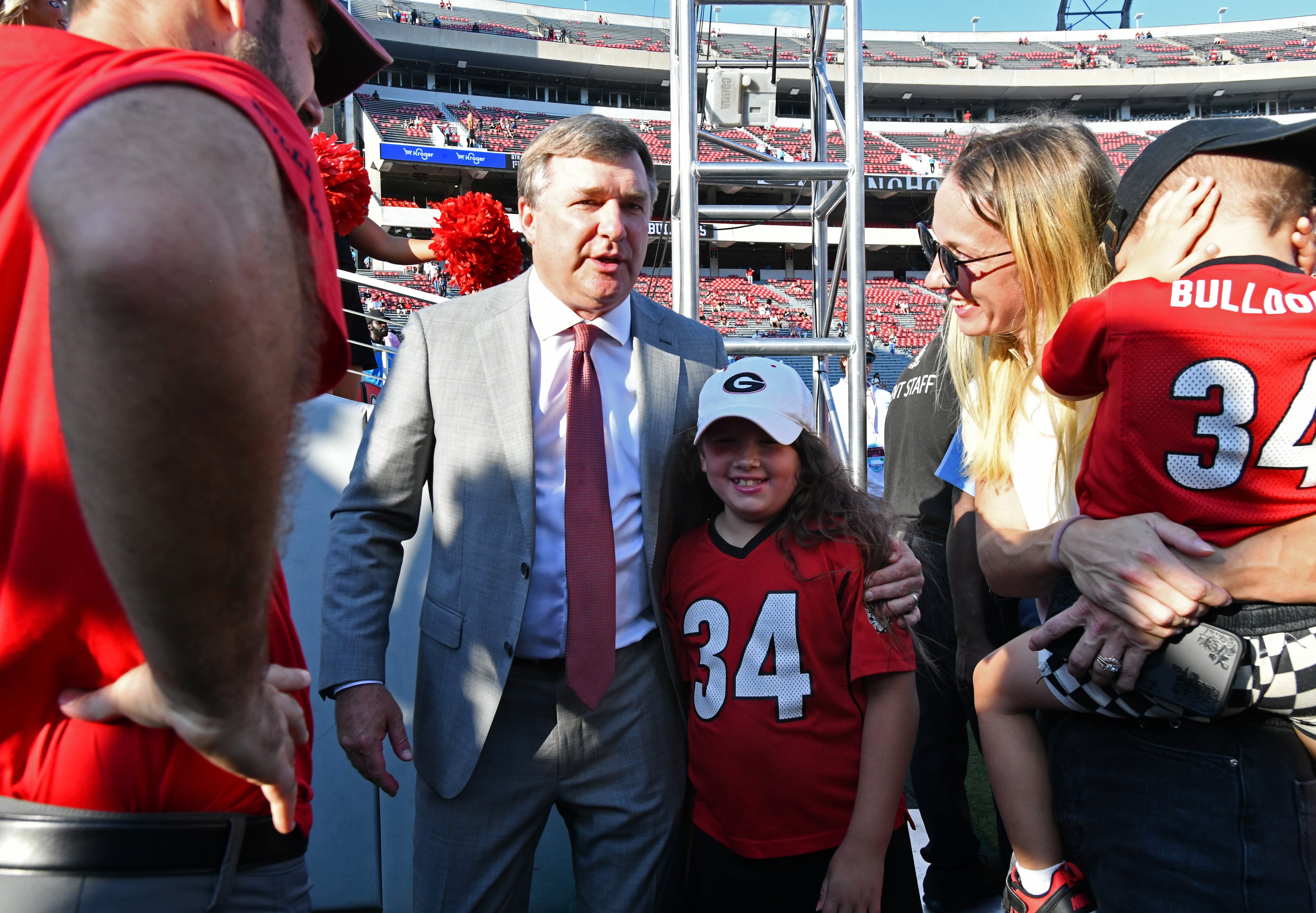 Georgia head coach Kirby Smart greets a young fan during the Dawg Walk to play Alabama in a NCAA college football game at Sanford Stadium, Saturday, September 27, 2025, in Athens. (Hyosub Shin / AJC)