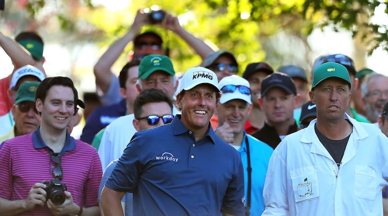 Phil Mickelson cracks a joke to the gallery around the fourth tee during his Tuesday practice round for the Masters. (Curtis Compton/ccompton@ajc.com)