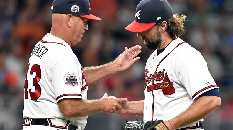 ATLANTA, GA - SEPTEMBER 4: R. A. Dickey #19 of the Atlanta Braves is removed from the game by Manager Brian Snitker #43 during the fifth inning against the Texas Rangers at SunTrust Park on September 4, 2017 in Atlanta, Georgia. (Photo by Scott Cunningham/Getty Images)