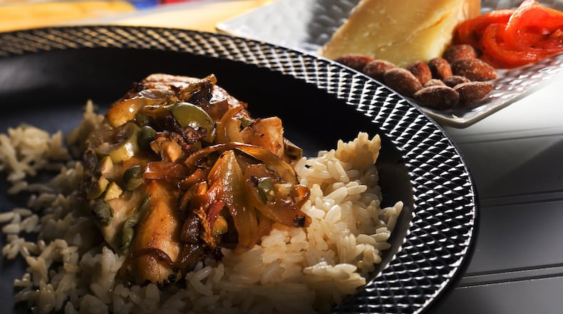 Made with olive oil, green olives, capers and dry sherry, this easy chicken recipe is a salute to Spain. (Bob Fila/Chicago Tribune/TNS)