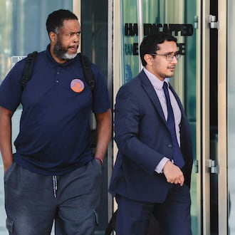 Former NBA player and assistant coach Damon Jones, left, leaves Lloyd George U.S. Courthouse Thursday, Oct. 23, 2025 in Las Vegas. (Benjamin Hager/Las Vegas Review-Journal via AP)