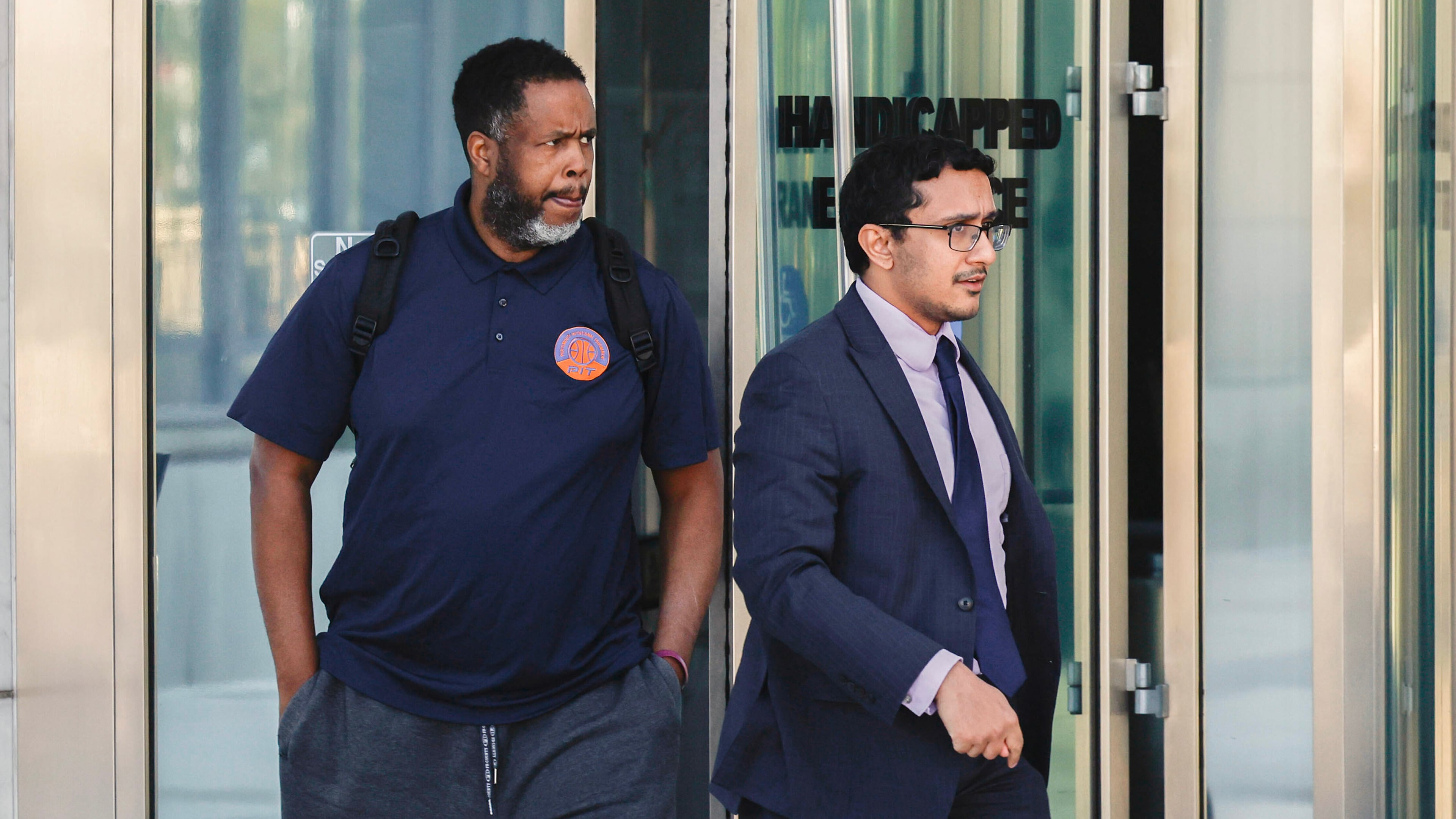 Former NBA player and assistant coach Damon Jones, left, leaves Lloyd George U.S. Courthouse Thursday, Oct. 23, 2025 in Las Vegas. (Benjamin Hager/Las Vegas Review-Journal via AP)