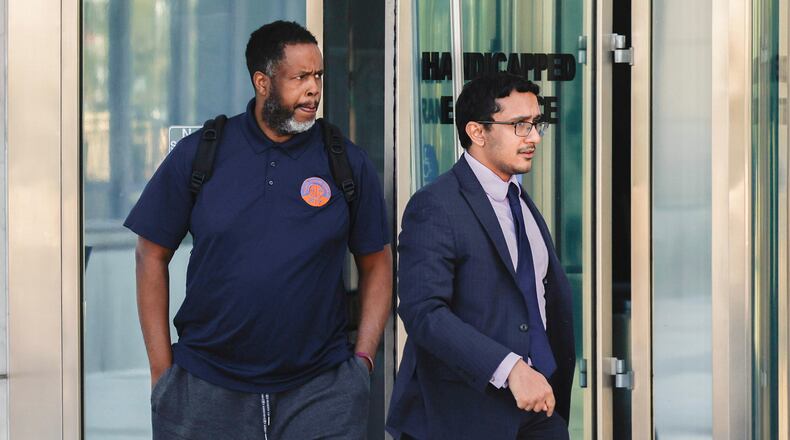 Former NBA player and assistant coach Damon Jones, left, leaves Lloyd George U.S. Courthouse Thursday, Oct. 23, 2025 in Las Vegas. (Benjamin Hager/Las Vegas Review-Journal via AP)