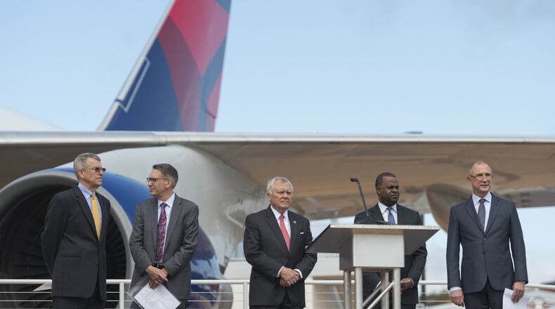 From left, John Boatright, President of the Delta Flight Museum; Randy Tinseth, Vice President of Marketing at Boeing; Georgia Gov. Nathan Deal; Atlanta Mayor Kasim Reed; and Glen Hauenstein, President of Delta Air Lines, prepare for a ceremony to open the new 747 Experience at Delta’s Atlanta museum. (DAVID BARNES / DAVID.BARNES@AJC.COM)