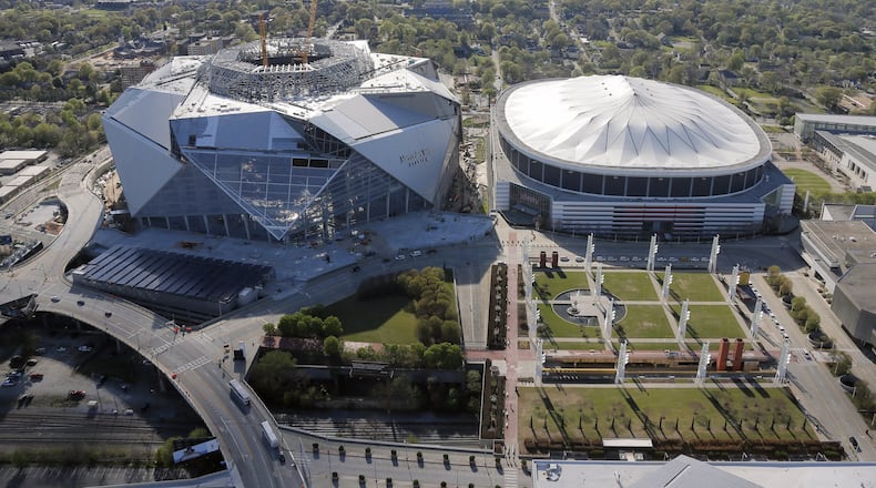Construction continues on Mercedes-Benz Stadium, next door to the Georgia Dome. Aerial photo was shot on March 31. BOB ANDRES /BANDRES@AJC.COM