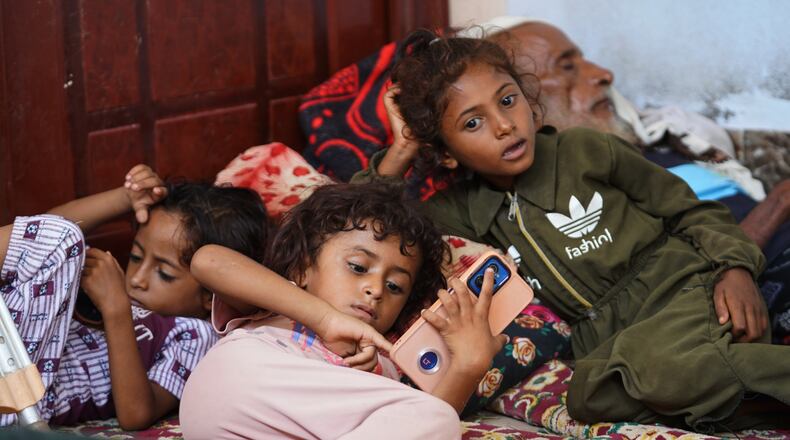 Displaced Yemenis rest at a temporary shelter in the Dar Saad district of Aden, Yemen, Saturday, Sept. 12, 2026, after fleeing Houthi attacks in the western coastal cities of al-Khokha and Mokha. (AP Photo/Abdulnasser Alseddik)