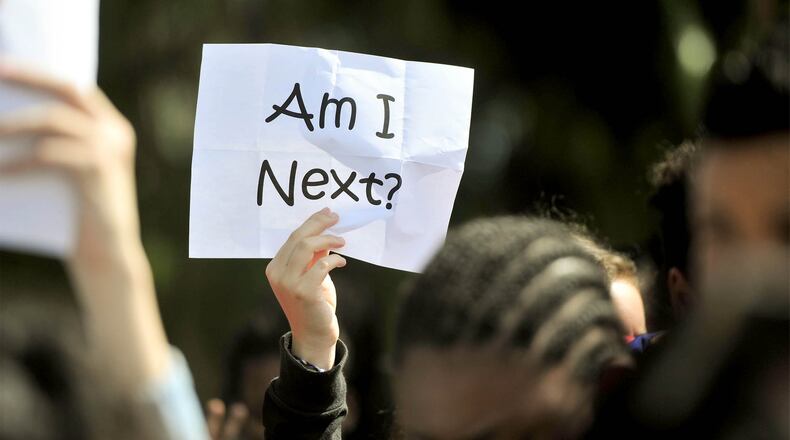 Students in West Palm Beach held a vigil and observed 17 minutes of silence for each of the Marjory Stoneman Douglas High School shooting victims. Thousands of Georgia students plan to do the same thing on March 14. Contributed