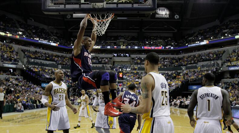 Atlanta Hawks' Al Horford dunks during the first half of Game 1 in the first round of the NBA basketball playoffs against the Atlanta Hawks Sunday, April 21, 2013, in Indianapolis. (AP Photo/Darron Cummings)