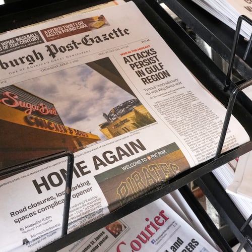The printed edition of the Pittsburgh Post-Gazette sits in a newspaper rack, Thursday, April 2, 2026, in Pittsburgh. (AP Photo/Gene J. Puskar)