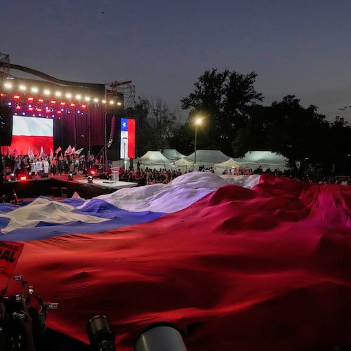 Supporters of Presidential candidate Jeannette Jara of the Unidad por Chile coalition attend a rally ahead of the presidential runoff election in Santiago, Chile, Wednesday, Dec. 10, 2025. (AP Photo/Esteban Felix)