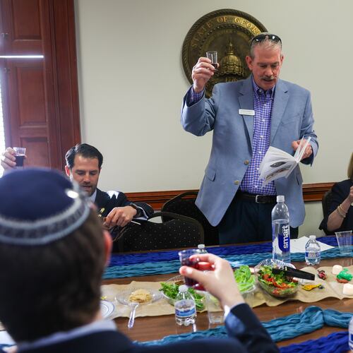 Roger Panitch presides over the Capitol’s first Passover Seder on Sine Die, the last day of the legislative session, in Atlanta on April 2, 2026. (Arvin Temkar/AJC)