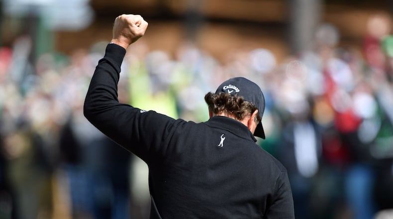 Phil Mickelson reacts to an eagle on the second green in the 81st Masters at the Augusta National Golf Club, Thursday April 6, 2017. BRANT SANDERLIN / SPECIAL