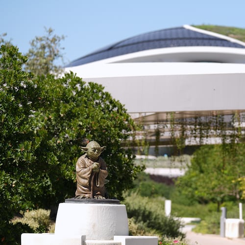 A sculpture of the "Star Wars" character Yoda is displayed along a walking path in the garden area of the the Lucas Museum of Narrative Art during a preview of the museum on Monday, Aug. 31, 2026, in Los Angeles. (AP Photo/Chris Pizzello)
