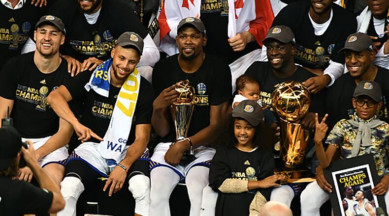 The Golden State Warriors pose for a team photo after winning the NBA Championship and defeating the Cleveland Cavaliers in Game Five of the 2017 NBA Finals on June 12, 2017 at ORACLE Arena in Oakland, California. (Photo by Garrett Ellwood/NBAE via Getty Images)