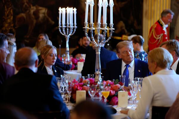 President Donald Trump, center right, and Italy's Prime Minister Giorgia Meloni, center left, attend a dinner for NATO heads of state and government at the Paleis Huis ten Bosch ahead of the NATO summit in The Hague, Netherlands, Tuesday, June 24, 2025. (Remko de Waal, Pool Photo via AP)