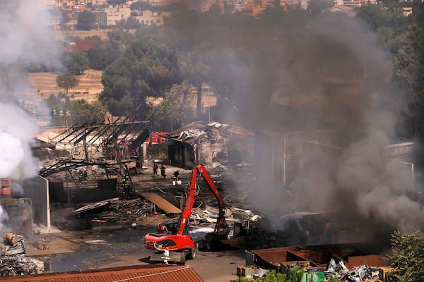 Firefighters at the scene of an explosion at a gas station in Rome, Italy, Friday, July 4, 2025. (Cecilia Fabiano/LaPresse via AP)