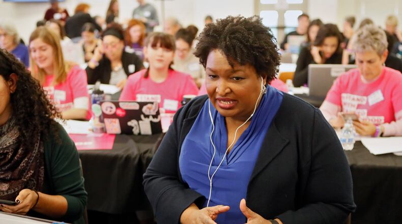 November 21, 2019 - Atlanta - Stacey Abrams makes some calls at the phone bank. Democratic presidential candidates including Cory Booker, Amy Klobuchar, Andrew Yang and Pete Buttigieg, along with Stacey Abrahms, were calling and texting voters Thursday whose registrations could be canceled in Georgia at a Fair Fight phone bank at Ebenezer Baptist Church in Atlanta. The phone bank was in response to Georgia election officials' plan to cancel more than 313,000 voter registrations next month. Bob Andres / robert.andres@ajc.com