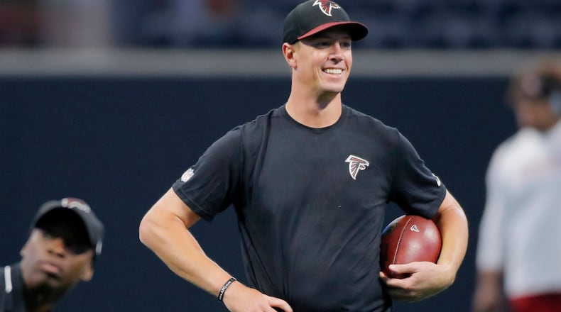 8/26/17 - Atlanta, GA - Atlanta Falcons quarterback Matt Ryan seems to like what he sees as he takes the field for early pregame warmups. The first game in Mercedes-Benz Stadium was Saturday, as the Atlanta Falcons played Arizona in an exhibition game. JOHN SPINK /JSPINK@AJC.COM