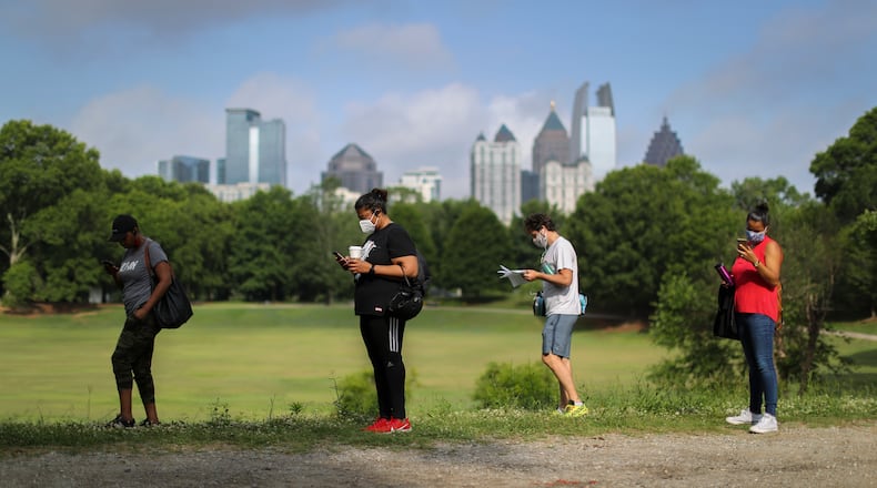 June 9, 2020 Atlanta: Voters had a long wait (some 2-3 hours) at the Park Tavern polling place located at 500 10th St NE, on Tuesday, June 9, 2020 in Atlanta. Many voters said they requested absentee ballots but never received them. Two lines, 300-yards long each formed parallel to Piedmont park in the parking lot as people patiently waited to vote. Over 1.2 million people had already voted before the polls opened on Tuesday, three-quarters of them with absentee-by-mail ballots, allowing them to avoid human contact at the polls. Voters will decide on many candidates, from president to county sheriff. The ballot also includes races for U.S. Senate, U.S. House and the Georgia General Assembly. JOHN SPINK/JSPINK@AJC.COM