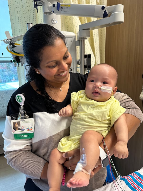 Chloe is held by a pediatric cardiologist at Children's Healthcare of Atlanta. (Photo provided by Children's Healthcare of Atlanta)