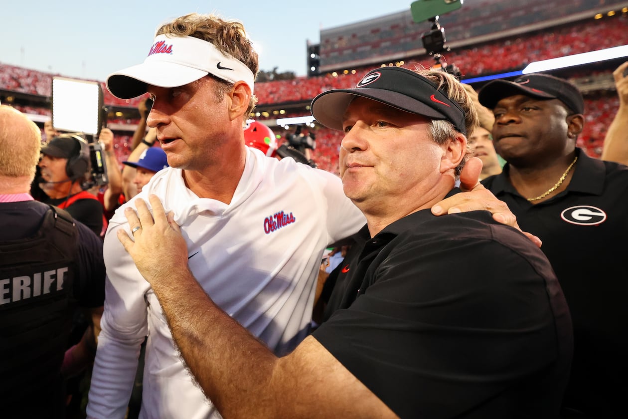 Mississippi head coach Lane Kiffin and Georgia head coach Kirby Smart bring out the best in each other when their teams clash with their different personalities and contrasting on-field strengths. (Colin Hubbard/AP)