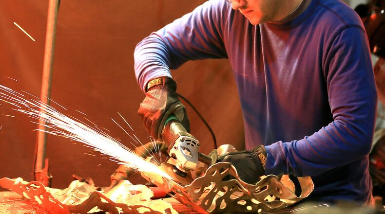 Mike Sluder, an Atlanta metal sculptor and patineur, uses a lot of fire in his very physical work. Known for his bronze castings and copper wall pieces, Sluder also does custom steel fabrication for homes. Contributed by MarkSluderPhotographs.com
