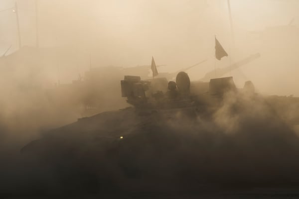 An Israeli military APC maneuvers at a gathering point near the Gaza Strip, in southern Israel, July 21, 2025. (AP Photo/Ariel Schalit)