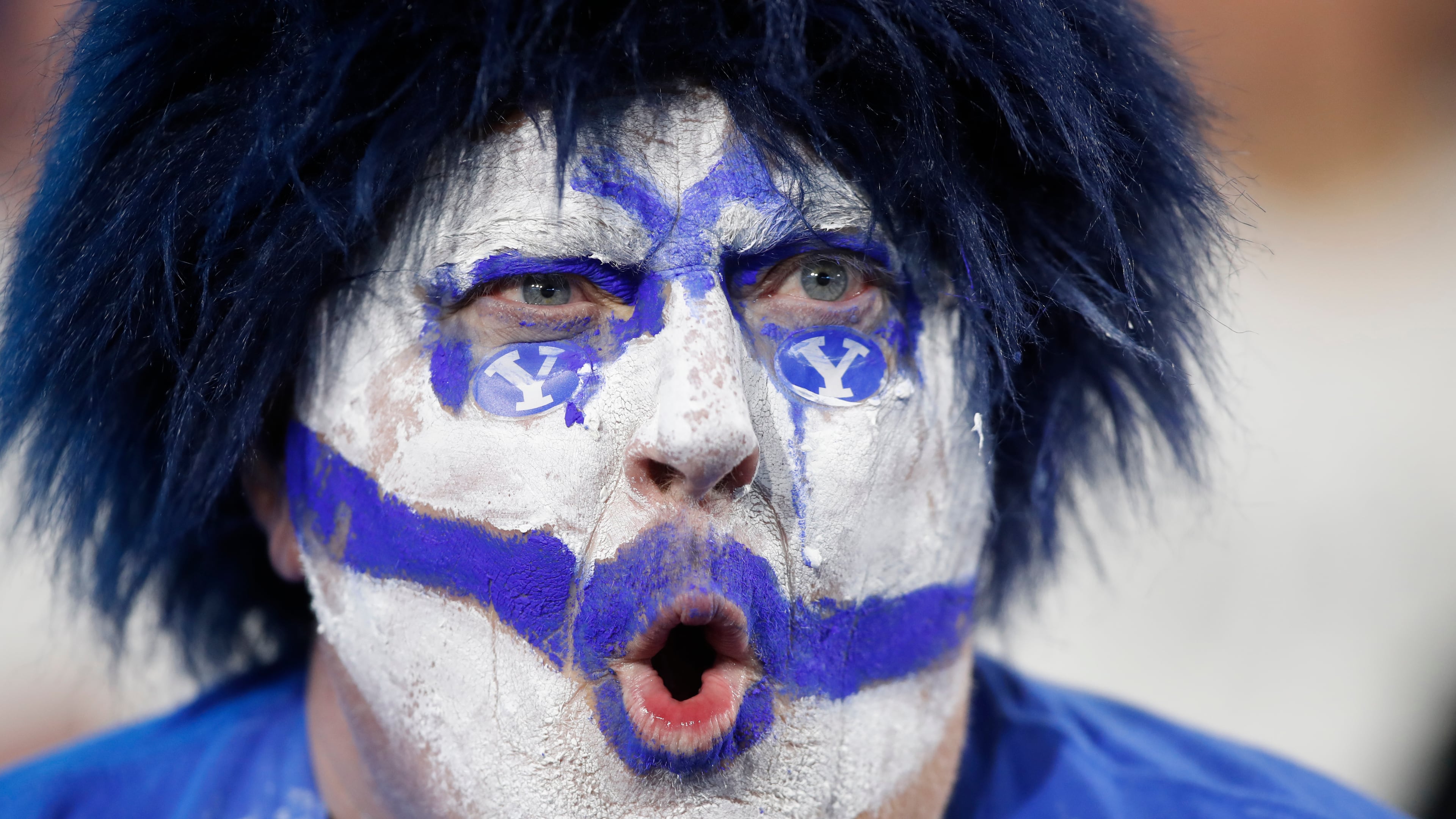 A BYU fan cheers during the second half of an NCAA college football game against TCU Saturday, Nov. 15, 2025, in Provo, Utah. (AP Photo/George Frey)