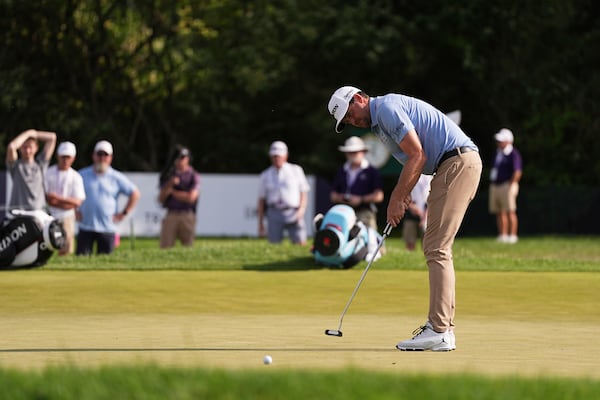 Keegan Bradley putts on the ninth green during the first round of the Truist Championship golf tournament at the Philadelphia Cricket Club, Thursday, May 8, 2025, in Flourtown, Pa. (AP Photo/Matt Rourke)