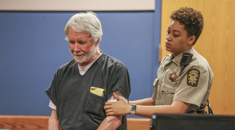 June 6, 2017 Atlanta: Fulton County deputy, K. Jackson brings Claud “Tex” McIver into the courtroom. Atlanta attorney, Claud “Tex” McIver was arraigned for murder on Tuesday, June 6, 2017. JOHN SPINK/JSPINK@AJC.COM.
