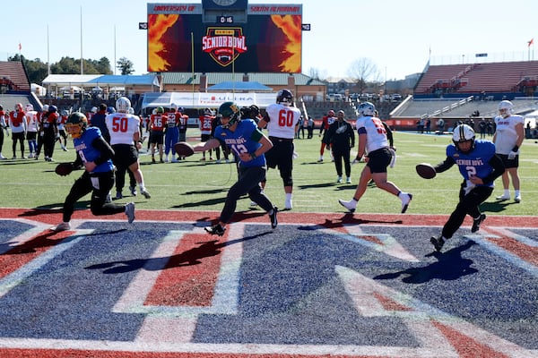Quarterbacks Cole Payton (9, North Dakota State), Sawyer Robertson (12, Baylor) and Diego Pavia (2, Vanderbilt) run through some Senior Bowl drills on Tuesday.