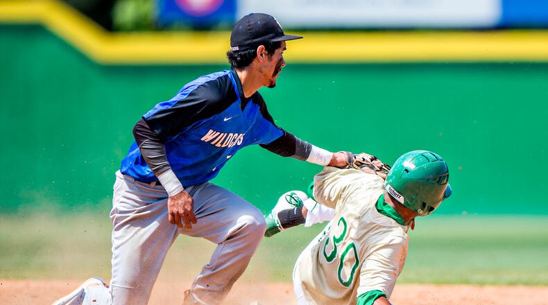 May 21, 2016 Buford - Locust Grove's Odlanier Rodriguez (left) tags out Buford's Nick Wilhite during the GHSA Class AAAA Championship Baseball Tournament in Buford on Saturday, May 21, 2016. JONATHAN PHILLIPS / SPECIAL