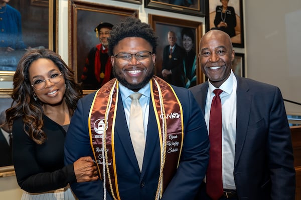 Morehouse College senior Daymond Johnson, a recipient of the Oprah Winfrey Scholarship, stands with Winfrey and college president F. DuBois Bowman during Winfrey's surprise visit on Friday, April 24, 2026. Johnson will be interning with the NBA after graduation before beginning a full-time job with Bank of America. (Courtesy of Morehouse College)