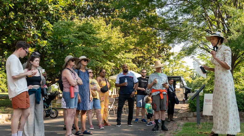 Volunteer tour guide Jihan Hurse speaks to tour goers. Atlanta residents celebrate at the Oakland Cemetary Juneteenth Family Festival. This is the third Juneteenth since becoming a federal holiday in 2021. Saturday, June 15, 2024 (Ben Hendren for the Atlanta Journal-Constitution) Atlanta residents celebrate at the Oakland Cemetary Juneteenth Family Festival. This is the third Juneteenth since becoming a federal holiday in 2021. Saturday, June 15, 2024 (Ben Hendren for the Atlanta Journal-Constitution)