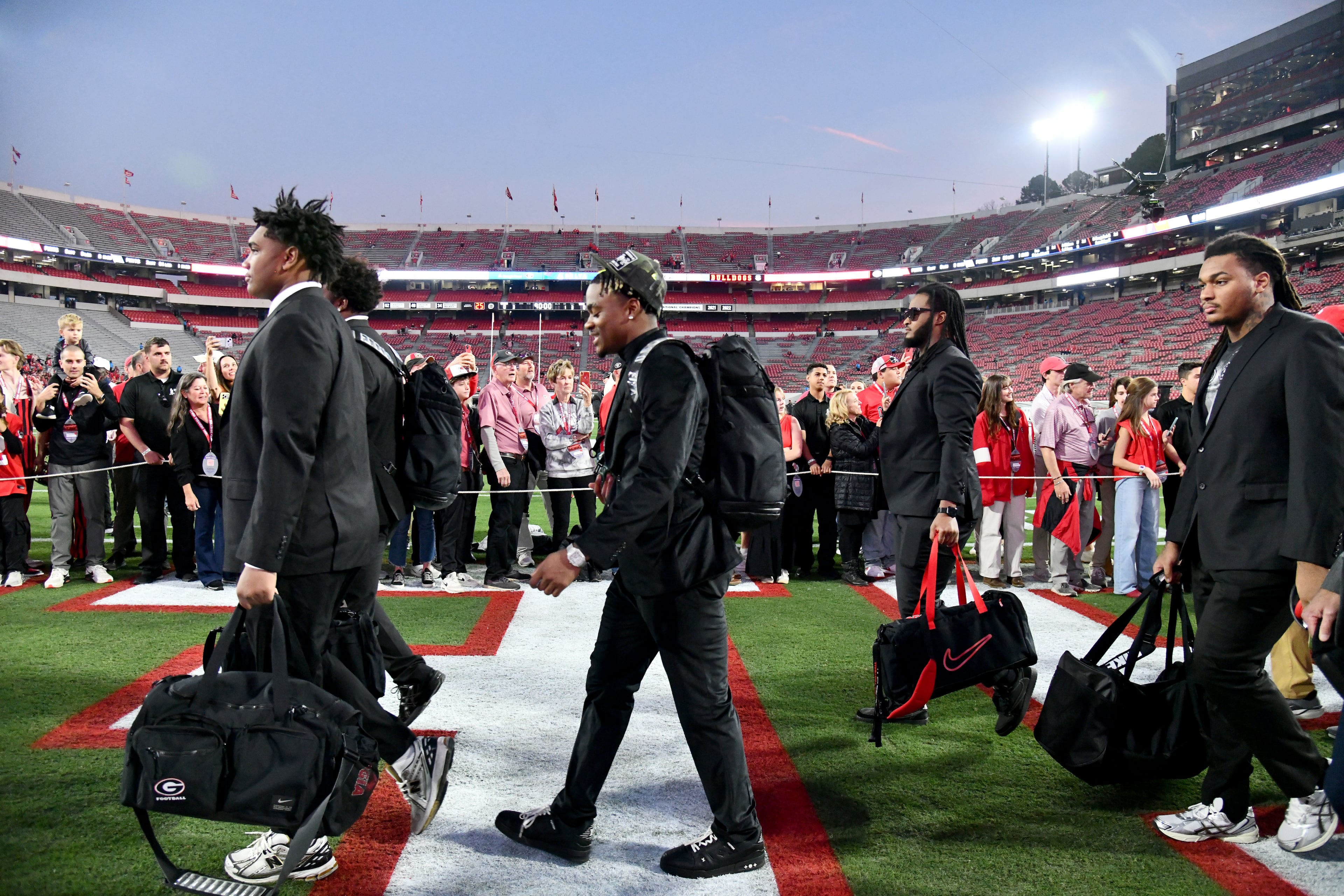 Georgia players and staff arrive during Dawgs Walk before an NCAA football game between Georgia and Texas at Sanford Stadium, Saturday, November 15, 2025, in Athens. (Hyosub Shin / AJC)
