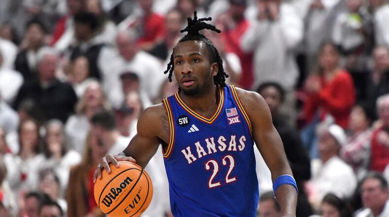 Kansas guard Darryn Peterson dribbles during the second half of an NCAA college basketball game against Texas Tech, Monday, Feb. 2, 2026, in Lubbock, Texas. (AP Photo/Annie Rice)