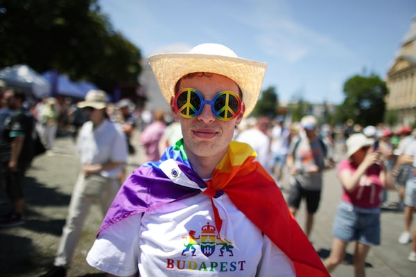 A participant poses as people start gathering for the Pride march in Budapest, Hungary, Saturday, June 28, 2025. (AP Photo/Rudolf Karancsi)